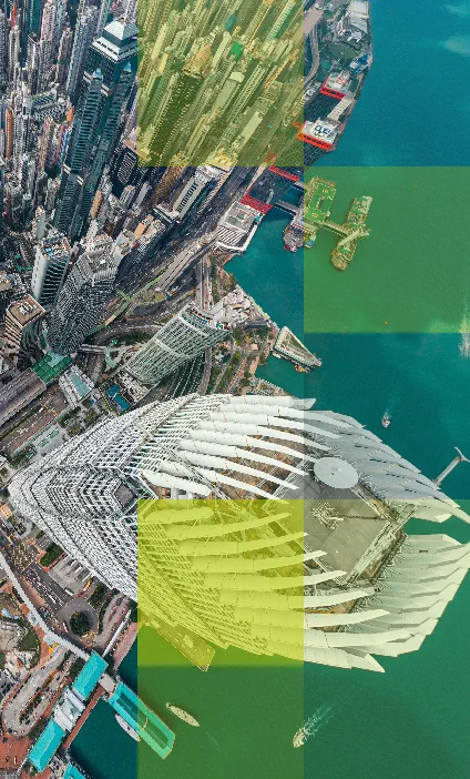 Aerial view of Hong Kong’s urban and waterfront landscape, representing the digital transformation of the city’s pension system led by the MPFA.